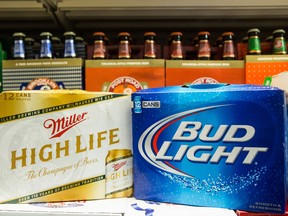 NEW YORK, NY - OCTOBER 09: In this photo illustration, Bud Light beer and Miller High Life beer are sold in a grocery store on October 9, 2015 in New York City. Budweiser's parent company AB InBev is attempting to buy SABMiller. (Photo by Andrew Burton/Getty Images)