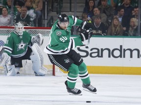 Jason Spezza #90 of the Dallas Stars handles the puck against the Ottawa Senators at the American Airlines Center on November 24, 2015 in Dallas, Texas.