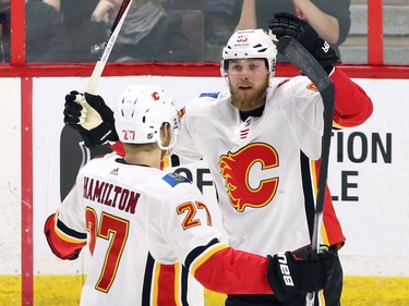Flames centre Sam Bennett celebrates his goal against the Senators with Dougie Hamilton during the first period.