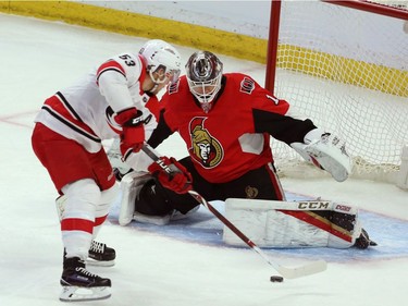 Hurricanes centre Jeff Skinner prepares to backhand the puck past Senators netminder Mike Condon for a third-period goal.