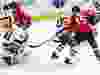 New York Islanders goaltender Jaroslav Halak (41) makes a save on Ottawa Senators right wing Alexandre Burrows (14) as New York Islanders defenceman Adam Pelech (50) and Ottawa Senators left wing Zack Smith (15) battle in front during first period NHL hockey in Ottawa, Tuesday, March 27, 2018.