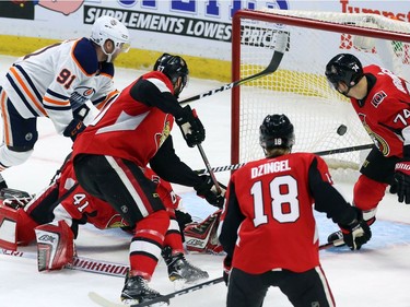 Edmonton Oilers left wing Drake Caggiula (91) shoots the puck past Ottawa Senators goaltender Craig Anderson (41) to score during first period NHL hockey in Ottawa on Thursday, March 22, 2018.