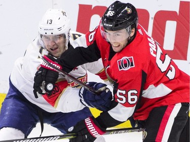 Florida Panthers defenceman Mark Pysyk (13) and Ottawa Senators left wing Magnus Paajarvi (56) battle it out during the second period of NHL hockey action in Ottawa on Tuesday, March 20, 2018.