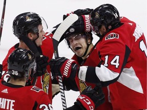 Senators centre Jean-Gabriel Pageau gets some playful (44) celebrates his game-winning goal against the Florida Panthers with centre Colin White (36), defenceman Thomas Chabot (72) and right wing Alexandre Burrows (14) during overtime NHL hockey action in Ottawa on Thursday, March 29, 2017.