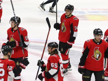 Senators players raise their sticks to acknowledge the fans after Mike Hoffman's goal gave them a 3-2 win over the Stars at Canadian Tire Centre on Friday night.