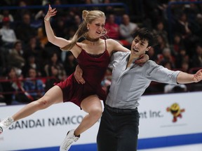 Kaitlyn Weaver and Andrew Poje of Canada perform during the ice dance free skate program in Milan on Saturday.