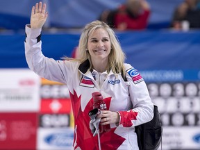 Canada skip Jennifer Jones waves to the crowd as she leaves the ice after defeating Japan at the World Women's Curling Championship Friday, March 23, 2018 in North Bay, Ont. (THE CANADIAN PRESS/Paul Chiasson)