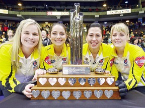 Team Manitoba's Jennifer Jones, Shannon Birchard, Jill Officer and Dawn McEwen pose with the Scotties Tournament of Hearts trophy they won in Penticton, B.C., Feb. 4. (THE CANADIAN PRESS/Sean Kilpatrick)