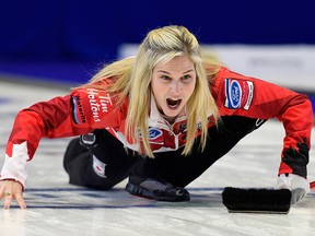 Canada skip Jennifer Jones calls to her sweepers against the United States during the semifinal at the World Women's Curling Championship in North Bay, Ont., Saturday, March 24, 2018. THE CANADIAN PRESS/Paul Chiasson
