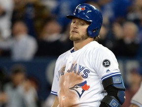 Toronto Blue Jays' Josh Donaldson (20) reacts after popping out during eighth inning American League baseball action against the New York Yankees in Toronto on Thursday, March 29, 2018. THE CANADIAN PRESS/Nathan Denette