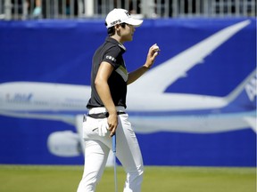 Sung Hyun Park waves to the crowd after completing the final hole of her round on Friday.