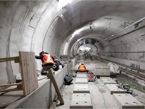 Workers install rail tracks through the Confederation Line LRT tunnel in a picture dated Feb. 16, 2018. Source: City of Ottawa