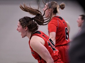 Ravens players Cynthia Dupont, front, and Alexandra Trivieri (6) celebrate the thrilling turn of events late in the second half against the Martlets on Saturday in Regina. Arthur Ward/Arthur Images