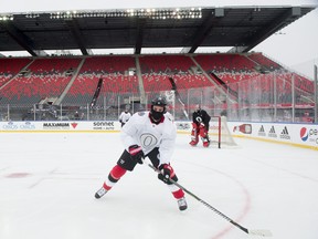 Ottawa Senators right wing Alexandre Burrows skates into the corner during practice on the outside ice Friday December 15, 2017 in Ottawa. The Ottawa Senators will play the Montreal Canadiens in the NHL 100 Classic. THE CANADIAN PRESS/Adrian Wyld ORG XMIT: ajw113