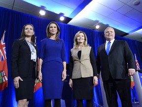 Ontario PC leadership candidates Tanya Granic Allen, Caroline Mulroney, Christine Elliott and Doug Ford pose for a photo after participating in a debate in Ottawa on Feb. 28. THE CANADIAN PRESS/Justin Tang