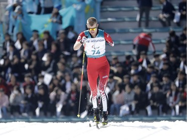 Mark Arendz of Canada competes in the qualification portion of the men's 1.5-kilometre cross-country ski sprint classic event on Wednesday. Arendz would finish the competition with a bronze-medal performance.