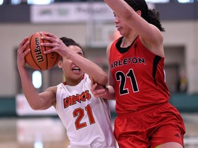 Elizabeth Leblanc, right, applies defensive pressure to Reyna Crawford during the Ravens-Dinos game in Regina on Thursday. Carleton won 52-42 to earn a spot in a Saturday semifinal against McGill. Arthur Ward/Arthur Images