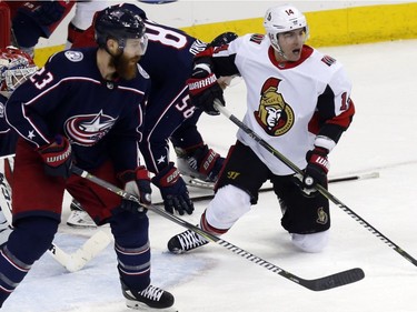 Senators forward Alex Burrows, right, battles in front of the BLue Jackets net in the third period. Columbus defenceman Ian Cole (23) is at the left.