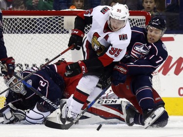 Senators forward Matt Duchene works for the puck between Blue Jackets goalie Sergei Bobrovsky and defenceman Jack Johnson during the second period.