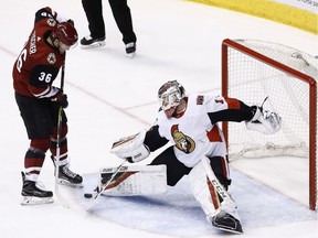 Senators goaltender Mike Condon makes a save on a shot by Coyotes forward Christian Fischer (36)