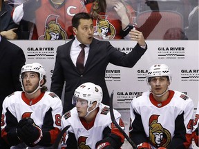Senators head coach Guy Boucher, top, gestures to his goalie to come off the ice during a game at Arizona on March 3. That was also the second part of back-to-back games for the Senators.