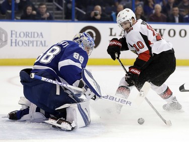Tampa Bay Lightning goaltender Andrei Vasilevskiy, (88) of Russia, stops a shot by Ottawa Senators left wing Tom Pyatt (10) during the first period of an NHL hockey game Tuesday, March 13, 2018, in Tampa, Fla.