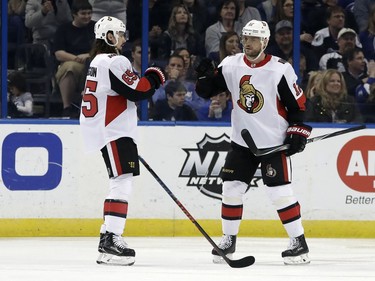 Ottawa Senators right wing Marian Gaborik, of Slovakia, celebrates his goal against the Tampa Bay Lightning with defenseman Erik Karlsson, of Sweden, during the second period of an NHL hockey game Tuesday, March 13, 2018, in Tampa, Fla.