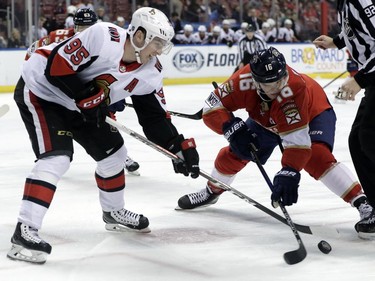 Ottawa Senators' Matt Duchene (95) and Florida Panthers' Aleksander Barkov (16) go for the puck on a face off during the first period of an NHL hockey game, Monday, March 12, 2018, in Sunrise, Fla.