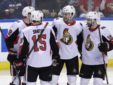 Ottawa Senators' Magnus Paajarvi, second from right, celebrates his goal with Zack Smith (15) and Tom Pyatt (10) during the third period of an NHL hockey game against the Florida Panthers, Monday, March 12, 2018, in Sunrise, Fla.