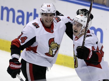 Ottawa Senators' Jean-Gabriel Pageau (44) celebrates with Alexandre Burrows (14) after scoring a goal during the third period of an NHL hockey game against the Florida Panthers, Monday, March 12, 2018, in Sunrise, Fla.