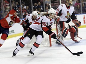 Senators captain Erik Karlsson (65) skates with the puck during Monday's game against the Florida Panthers.