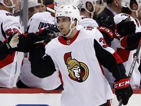Ottawa Senators' Colin White (36) celebrates his goal against the Pittsburgh Penguins as he returns to the bench during the second period of an NHL hockey game in Pittsburgh, Tuesday, Feb. 13, 2018.
