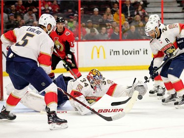 James Reimer pounces on the loose puck in the first period as the Ottawa Senators take on the Florida Panthers in NHL action at the Canadian Tire Centre in Ottawa.  Photo by Wayne Cuddington/ Postmedia