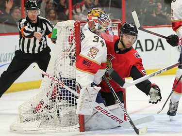 Referree Kevin Pollock signals a goal as Magnus Paajarvi is pushed into the net and goalie James Reimer in the first period as the Ottawa Senators take on the Florida Panthers in NHL action at the Canadian Tire Centre in Ottawa.  Photo by Wayne Cuddington/ Postmedia