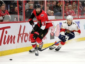 Ben Harpur skates away from Colton Sceviour in the second period as the Ottawa Senators take on the Florida Panthers in NHL action at the Canadian Tire Centre in Ottawa.