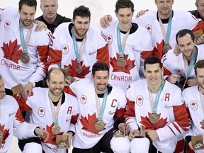 Canada men's hockey team players celebrate their win following third period men's hockey bronze medal game action against Czech Republic at the 2018 Olympic Winter Games, in Pyeongchang, South Korea, on Saturday, February 24, 2018. THE CANADIAN PRESS/Nathan Denette