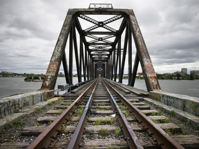 The Prince of Wales rail bridge is seen from the Gatineau side of the Ottawa River July 13, 2009.