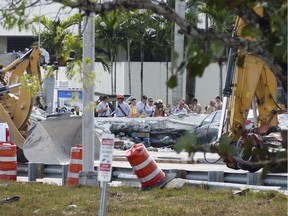 Recovery operations continue Saturday morning at the site of the bridge collapse in the Miami area. Roberto Koltun/Miami Herald via AP