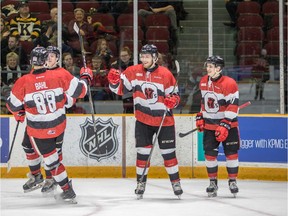 67's forward Quinn Yule, middle, celebrates a goal against the Frontenacs during Saturday's game. Valerie Wutti/Blitzen Photography/OSEG