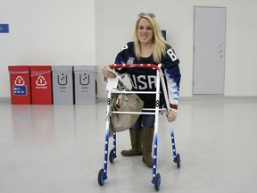 In this March 11, 2018, photo, Erica Mitchell, a Chicago native and an accomplished player in women's sled hockey, who came to the games as a spectator, poses at the Gangneung Hockey Center in Gangneung, South Korea. Mitchell was one of many people with disabilities who spoke to The Associated Press about accessibility problems at the Paralympic Games in South Korea's rural east, despite what organizers described as a "perfectly" organized event that provided the "highest level" of access.