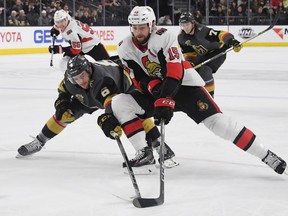 Zack Smith of the Ottawa Senators skates with the puck under pressure from Colin Miller of the Vegas Golden Knights in the first period of their game at T-Mobile Arena on March 2, 2018 in Las Vegas, Nevada.  (Ethan Miller/Getty Images)