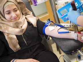 Douaa Amir was one of the first to donate at the Canadian Blood Services clinic in Ottawa as part of a national blood drive by Syrian Canadians on Saturday.   Ashley Fraser/Postmedia