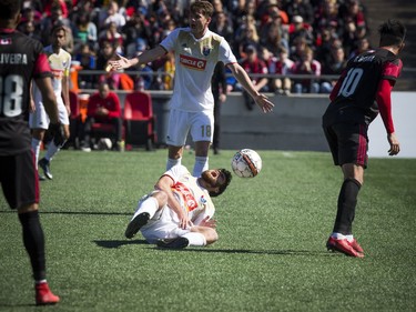 Ottawa Fury FC #10 Gerardo Bruna and North Carolina FC #16 Graham Smith crashed together during play at the Furry's home opener Saturday April 21, 2018 at TD Place.