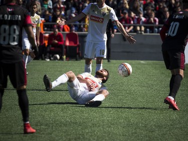 Ottawa Fury FC #10 Gerardo Bruna and North Carolina FC #16 Graham Smith crashed together during play at the Furry's home opener Saturday April 21, 2018 at TD Place.