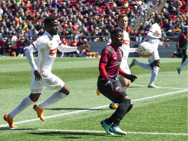 Ottawa Fury FC #30 Adonijah Reid tries to keep the ball away from North Carolina FC players during the Furry's home opener Saturday April 21, 2018 at TD Place.