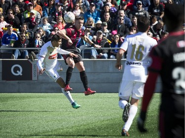 Ottawa Fury FC #9 Carl Haworth and North Carolina FC #33 Aaron Guillen head the ball during the Furry's home opener Saturday April 21, 2018 at TD Place.