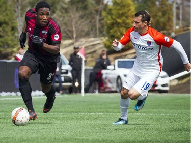 Ottawa Fury FC #3 Eddie Edward gets the ball from Cincinnati FC's #19 Corben Bone in the first half of the game Saturday April 28, 2018 at TD Place.   Ashley Fraser/Postmedia