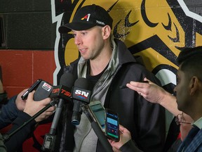 Craig Anderson searches for answers while being scrummed by the media as the Senators clear out their lockers on Monday. (WAYNE CUDDINGTON/Postmedia Network)