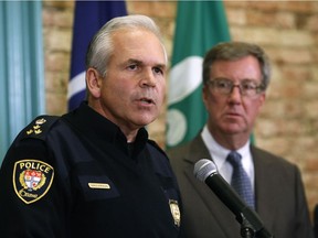 Ottawa police Chief Charles Bordeleau speaks at a news conference while Mayor Jim Watson looks on.