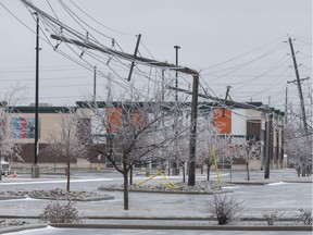 Hydro poles snapped in half at the Ottawa Train Yards shopping area during a severe spring storm. April 16, 2018.